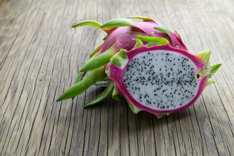 Dragon Fruit On old Wooden Table stock photography