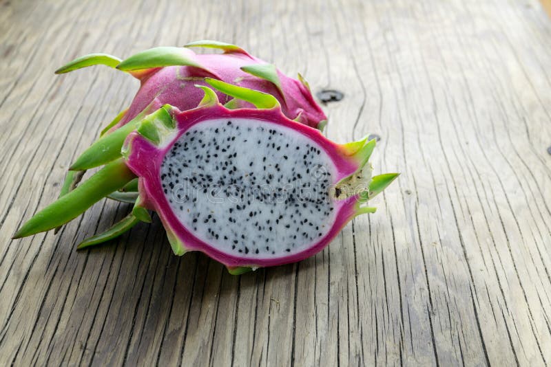 Dragon Fruit On old Wooden Table stock photography
