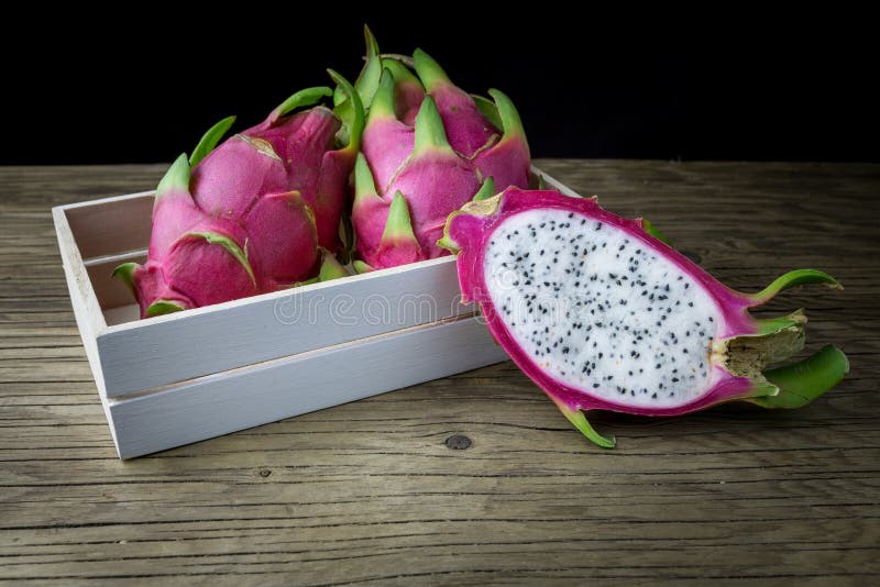 Dragon Fruit On old Wooden Table stock images