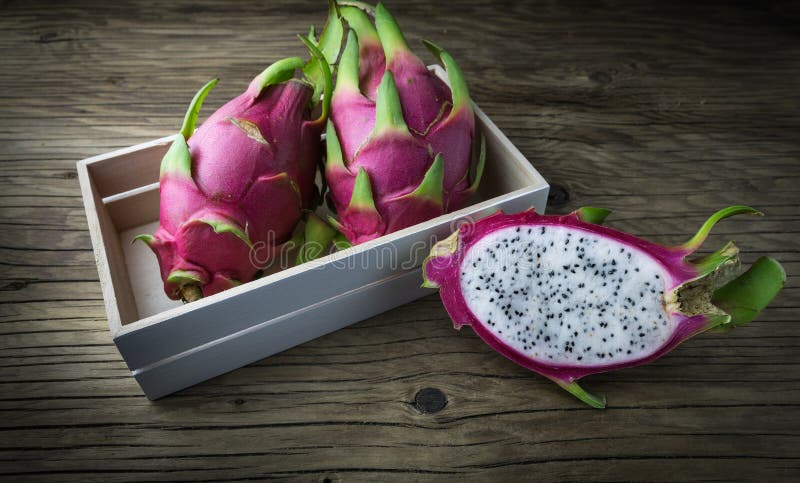Dragon Fruit On old Wooden Table stock image
