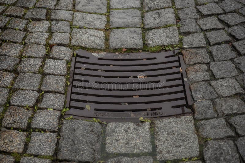 Drain Cover in the Middle of a Road Stock Image Image of