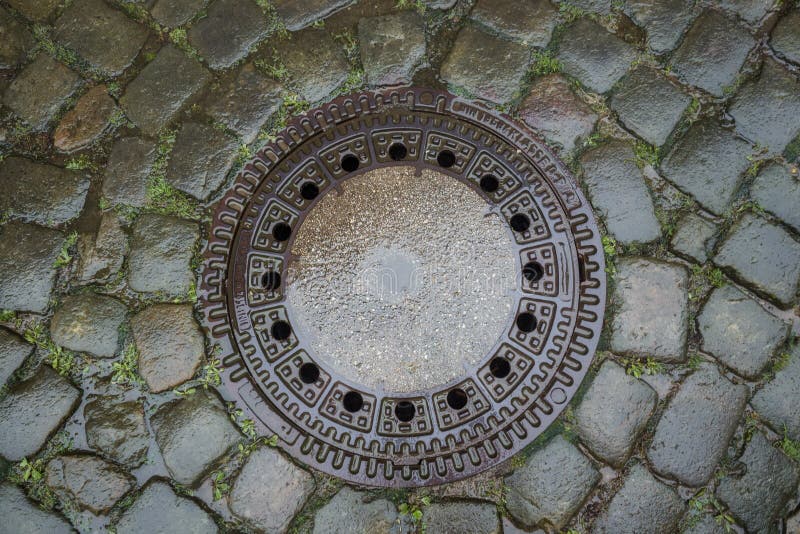 Drain Cover in the Middle of a Road Stock Image Image of