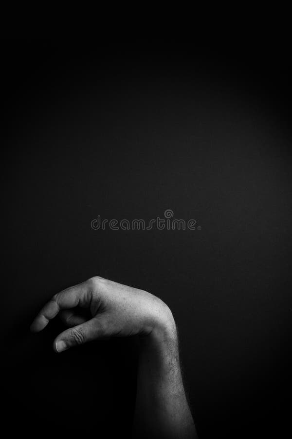 B&W image of hand demonstrating ASL sign language letter Q with empty copy space stock images