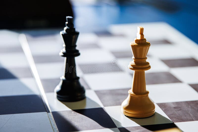 Dramatic chess endgame with two black and white lonely kings, symbolizing stalemate, board games strategy, intellectual challenge stock photography