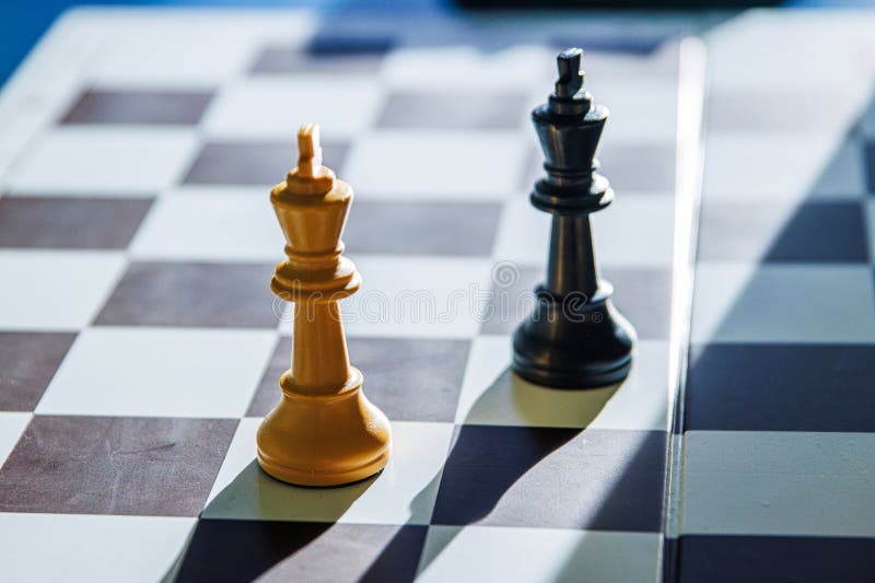 Dramatic chess endgame with two black and white lonely kings, symbolizing stalemate, board games strategy, intellectual challenge royalty free stock images