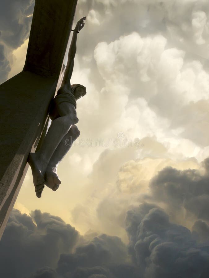 Looking upward into these dramatic storm clouds behind Jesus on the Cross represents Jesus Crucifixion on Good Friday and Rising again on Easter Sunday. Looking upward into these dramatic storm clouds behind Jesus on the Cross represents Jesus Crucifixion on Good Friday and Rising again on Easter Sunday