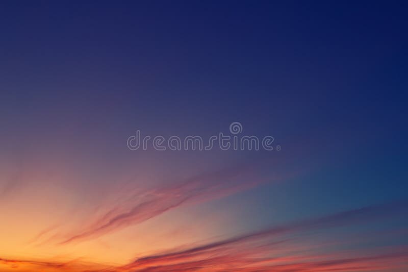 Dramatic colorful red purple to blue sunset or sunrise sky landscape. Natural beautiful cloudscape dawn background