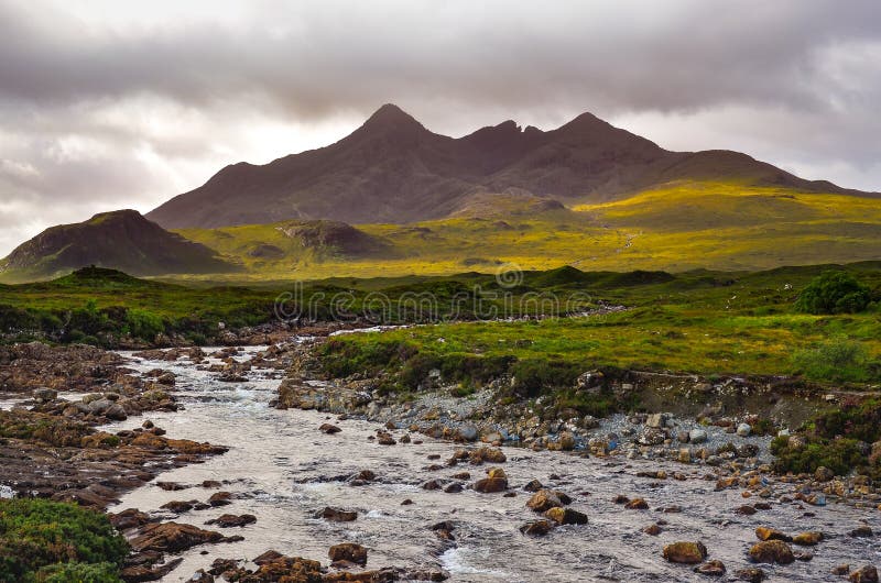 Dramatic landscape of Cuillin hills and river, Scottish highland