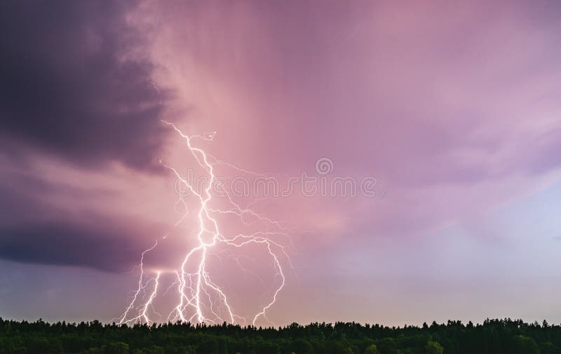 Dramatic Lightning Bolt At Night Over Rural Area. Agriculture Fields