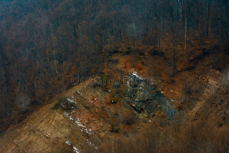 The Dramatic Mountain Granite Stone Stands Out from the Grass between
