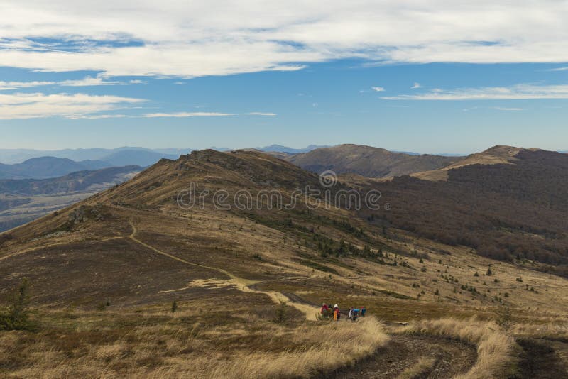 Dramatic mountain ridge moody autumn season time soft focus hiking group of people on touristic walking route dirt trail lonely royalty free stock photo Dramatic mountain ridge moody autumn season time soft focus hiking group of people on touristic walking route dirt trail lonely royalty free stock photo