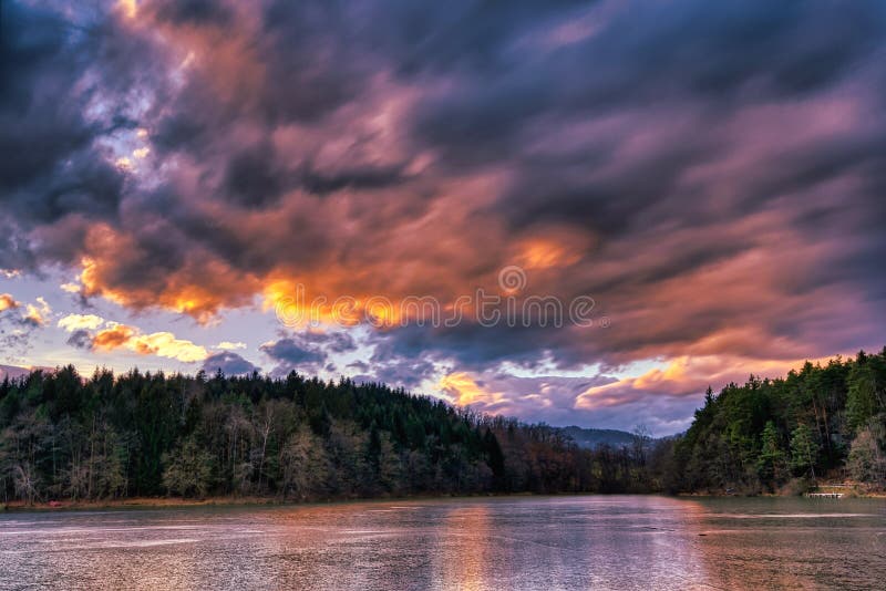 Dramatic sunset at a frozen lake royalty free stock images