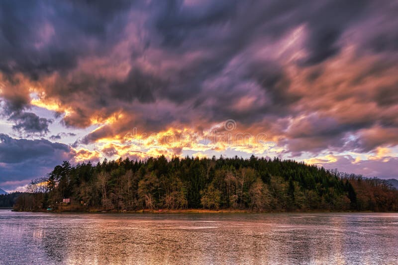Dramatic sunset at a frozen lake royalty free stock photo