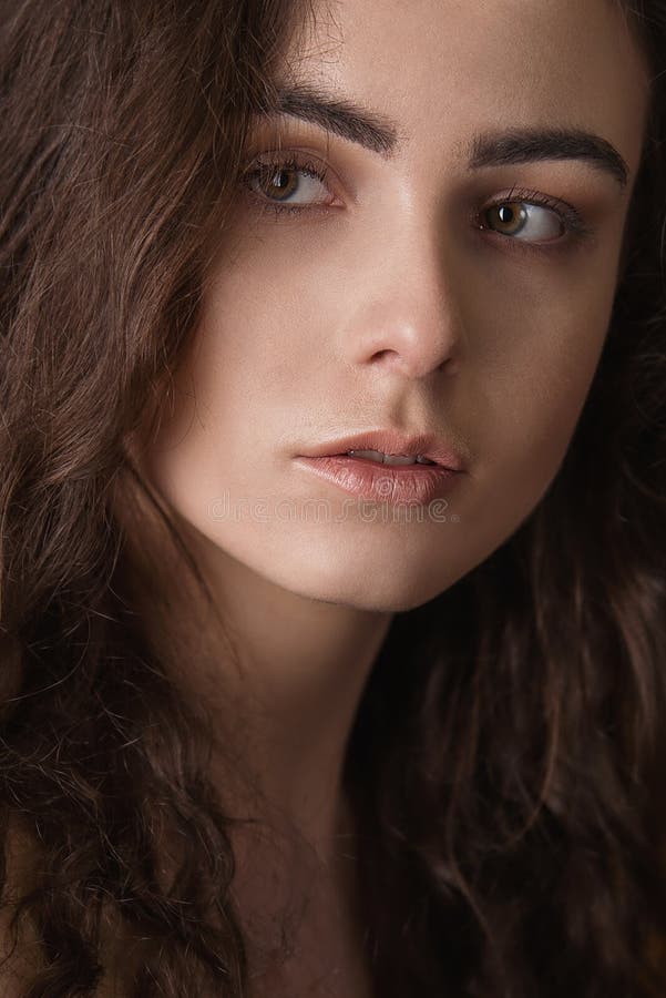 Dramatic Portrait of a Young Beautiful Brunette Girl with Long Curly ...