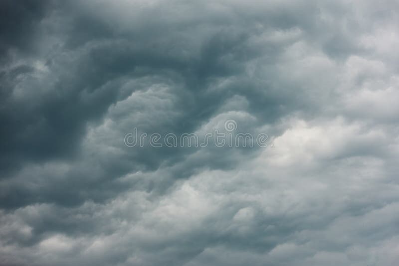 Dramatic sky - dark grey heavy clouds royalty free stock image