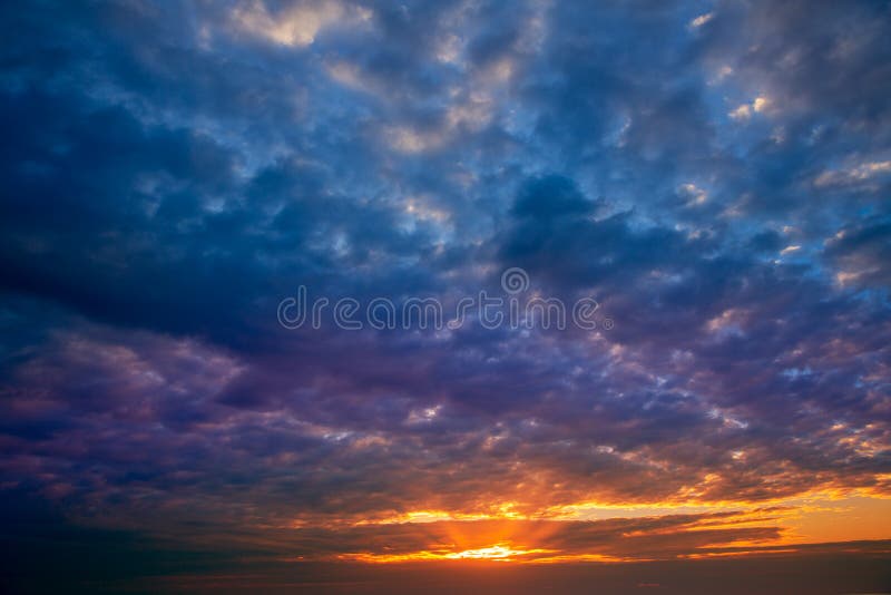 Dramatic sky with stormy clouds in sunset