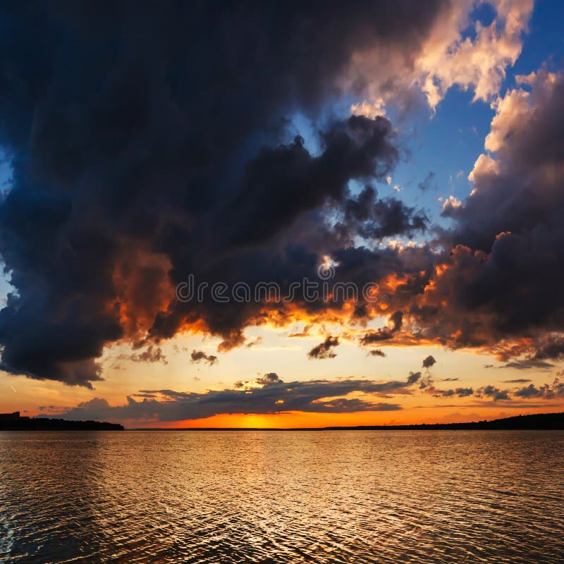 Dramatic sky, sunset over the water