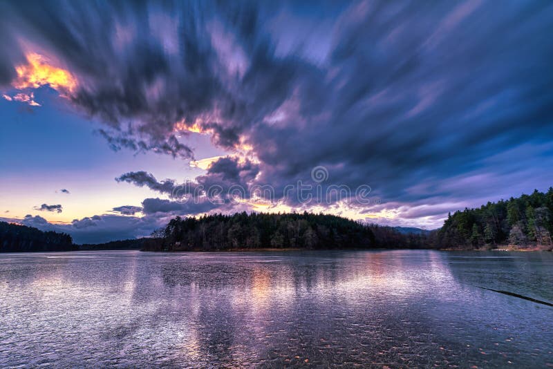 Dramatic sunset at a frozen lake royalty free stock images