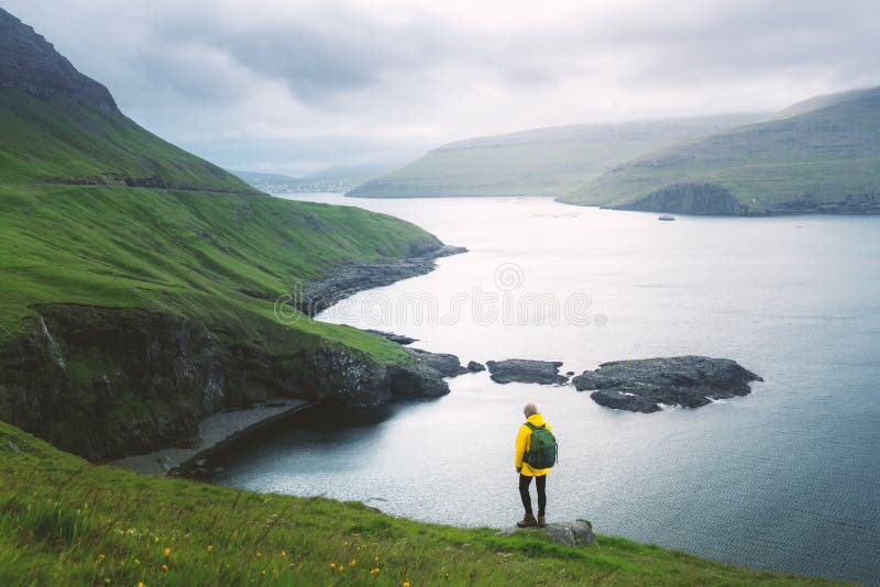 Dramatic view of green hills of Vagar island and Sorvagur town stock images Dramatic view of green hills of Vagar island and Sorvagur town stock images