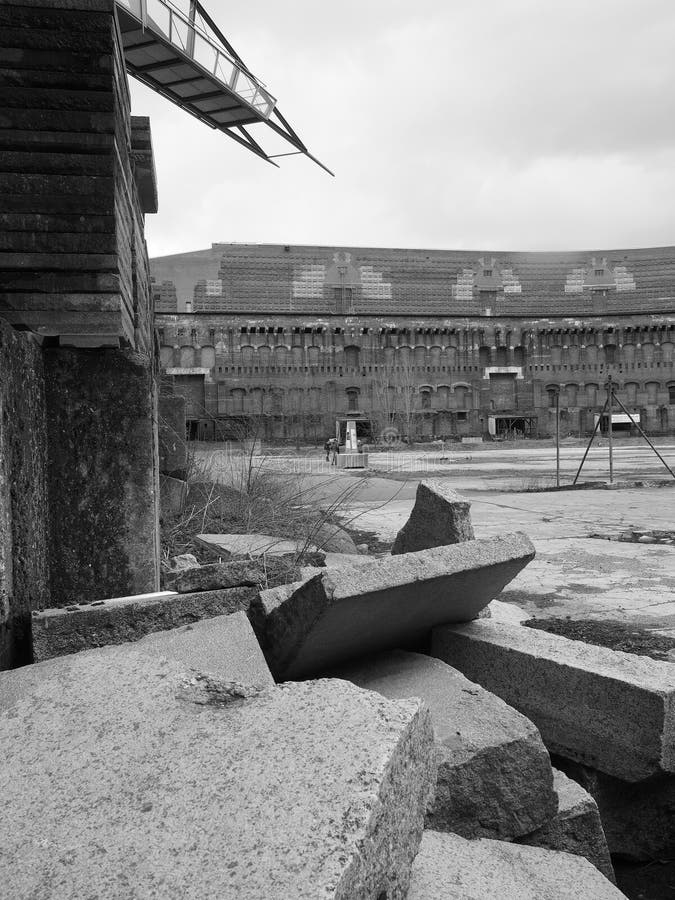 Nuremberg, Germany - 2015, April 2: Dramatic view of rubble inside the court yard of the former Nazi Party congress building in black and white. Nuremberg, Germany - 2015, April 2: Dramatic view of rubble inside the court yard of the former Nazi Party congress building in black and white