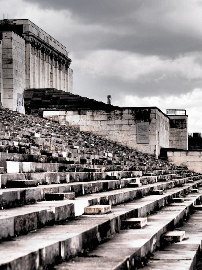 Nuremberg, Germany - 2015, April 2: Dramatic west view of the defunct main tribune left side of the former Nazi Party rally grounds called Zeppelin field. Nuremberg, Germany - 2015, April 2: Dramatic west view of the defunct main tribune left side of the former Nazi Party rally grounds called Zeppelin field.