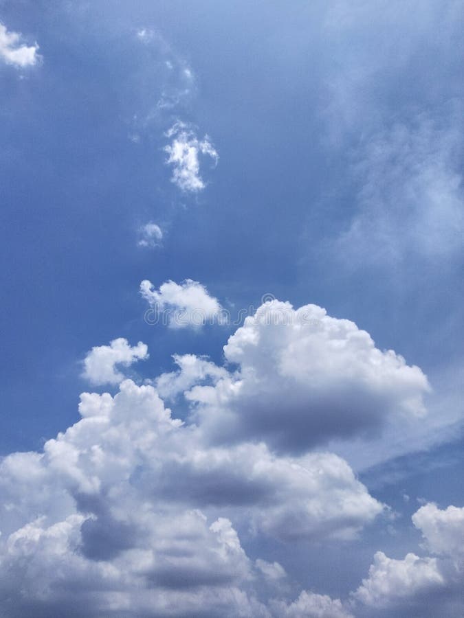 Dramatic White Clouds Float in the Blue Sky Stock Photo - Image of ...