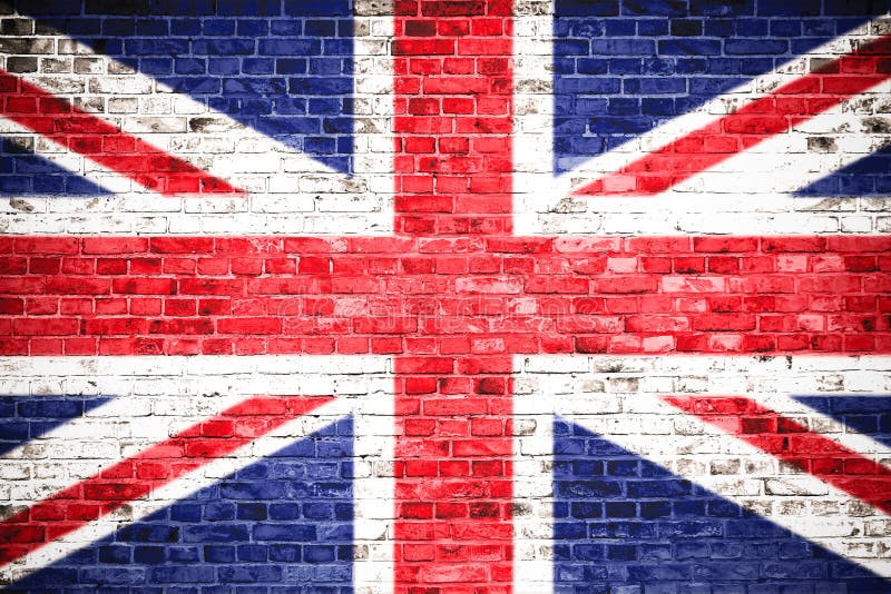 United Kingdom UK flag painted on a brick wall. Concept image for Great Britain, British, England, English language, people and culture. United Kingdom UK flag painted on a brick wall. Concept image for Great Britain, British, England, English language, people and culture.