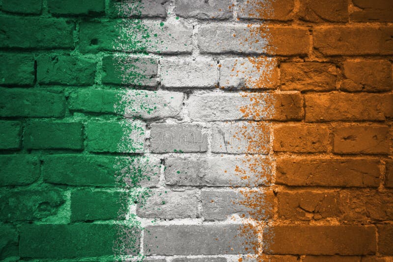 Colorful painted national flag of ireland on a old brick wall. Colorful painted national flag of ireland on a old brick wall