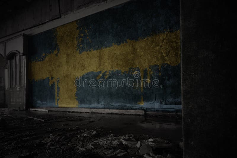 Painted flag of sweden on the dirty old wall in an abandoned ruined house. concept. Painted flag of sweden on the dirty old wall in an abandoned ruined house. concept