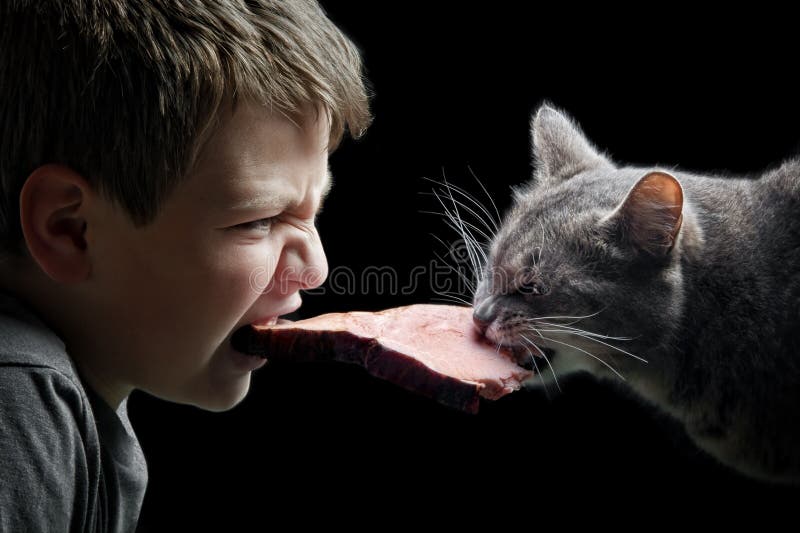 Boy and cat with bacon on black. Boy and cat with bacon on black