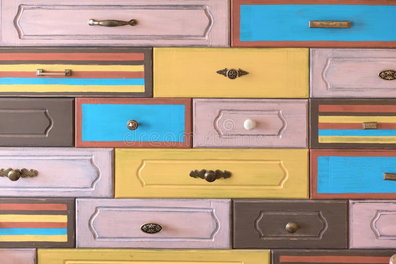 Drawer Handles Mounted On Vertical Multi Colored Facades Stock