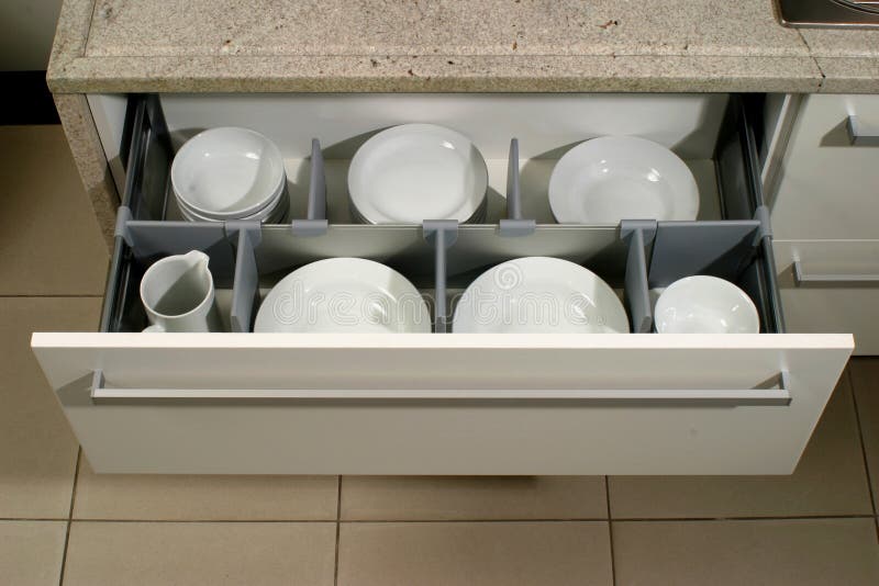 Drawer in a modern kitchen stock image. Image of plates - 11455013