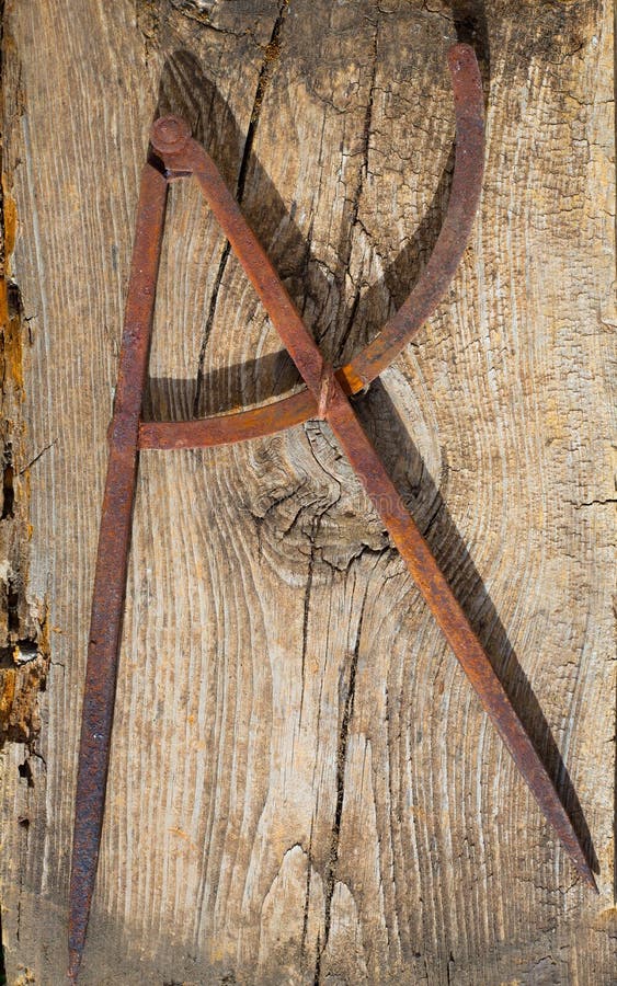 Drawing compass old in rusted iron carpenter tool stock images