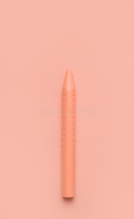 Beige pencil on a beige background. Monochrome image royalty free stock photos