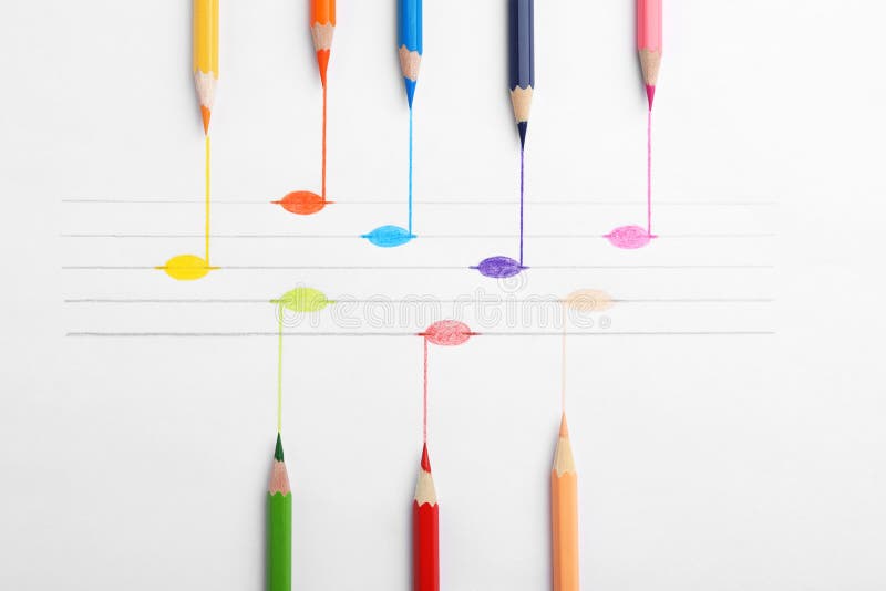 Drawing of musical notes and colorful pencils on white background, top view. Colorful musical notes stock images, royalty-free photos and pictures