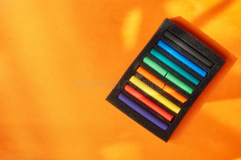 Drawing with Pastels. Multicolored Pastel Pieces in a Package Stock