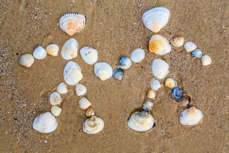 Drawing on the sand is couple in love royalty free stock images Drawing on the sand is couple in love royalty free stock images