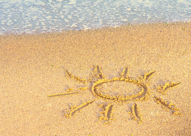 Drawing of the Sun on Sand with Sea Wave Stock Image - Image of symbol