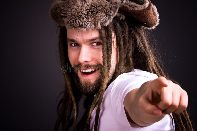 Guy with dreadlocks wearing a fur hat. Guy with dreadlocks wearing a fur hat