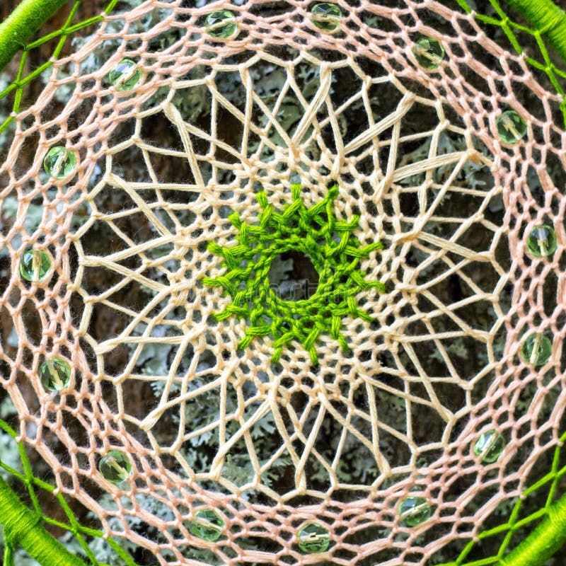Dreamcatcher made of feathers, leather, beads, and ropes stock image