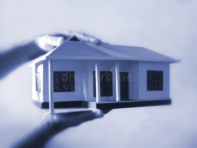 Dream Home. Home model holding in the hands Dream Home. Home model holding in the hands