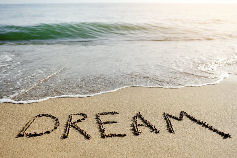 Dream word written on beach sand - positive thinking concept royalty free stock images Dream word written on beach sand - positive thinking concept royalty free stock images