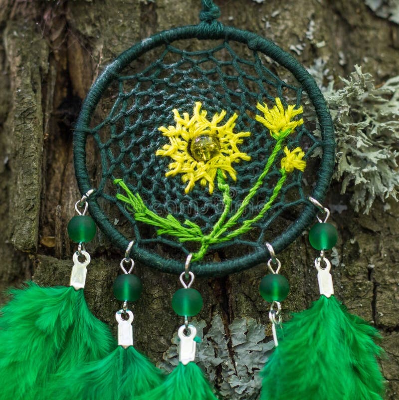 Dreamcatcher made of feathers, leather, beads, and ropes stock photo