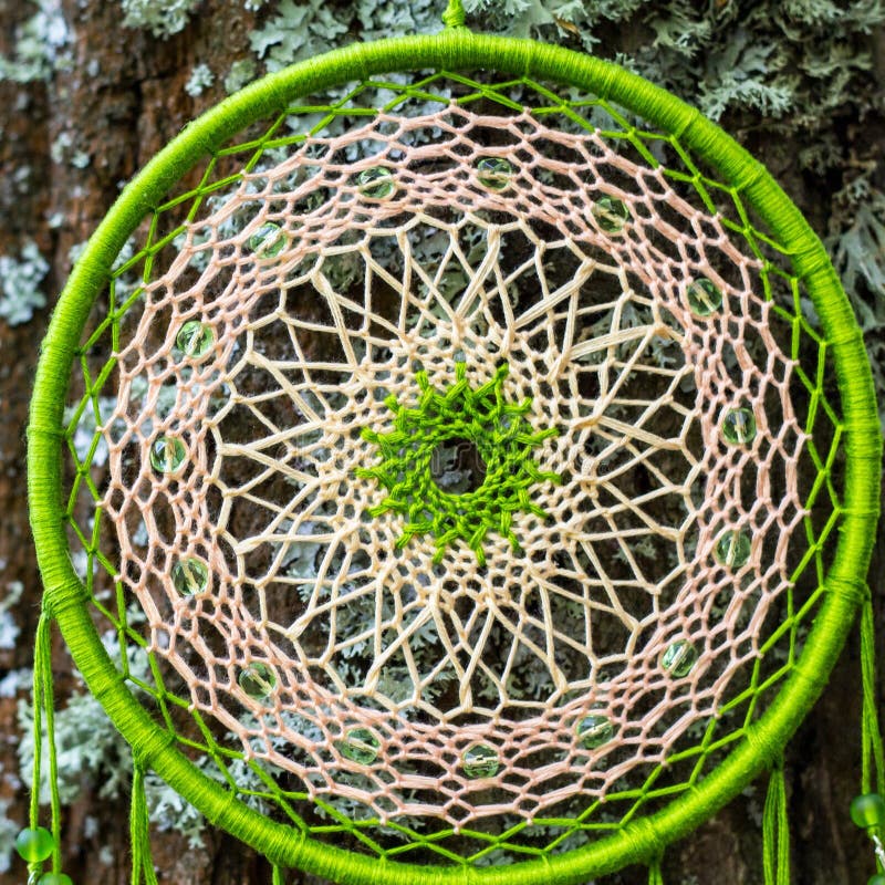 Dreamcatcher made of feathers, leather, beads, and ropes stock image