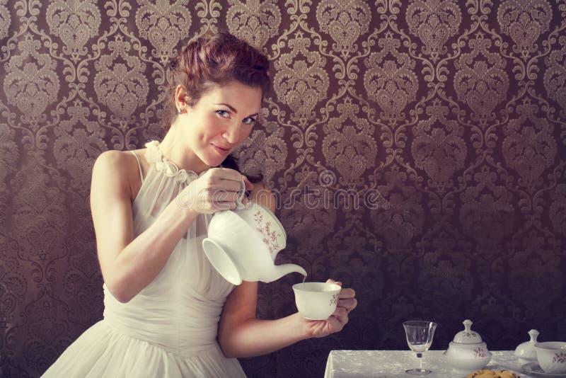 Dreamer woman drinking tea at tea time