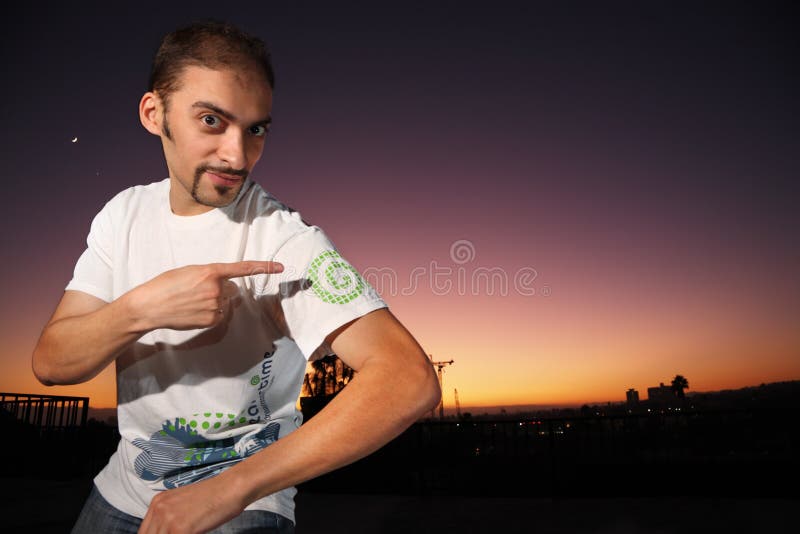 Young man in Dreamstime brand t-shirt. Young man in Dreamstime brand t-shirt