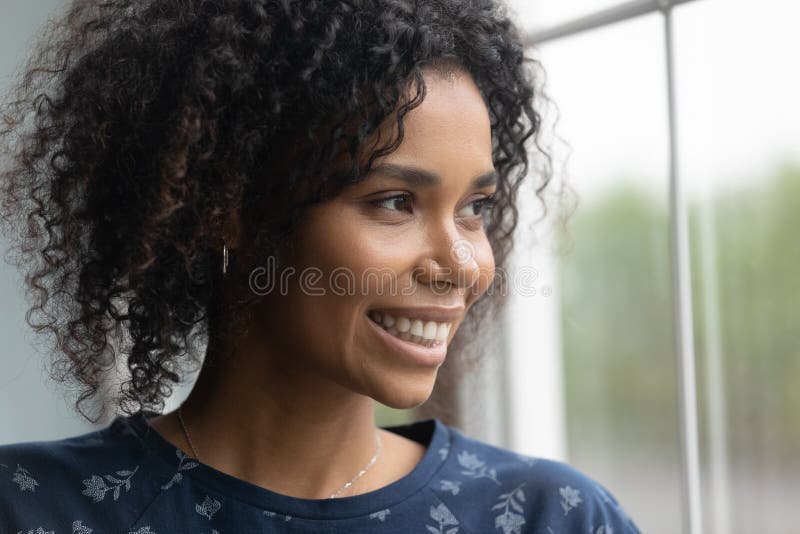 Dreamy Young Happy African American Woman Looking Out Of Window Stock 