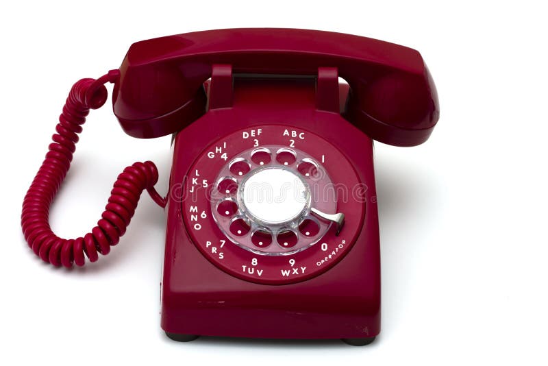 Red rotary telephone isolated a white background. Red rotary telephone isolated a white background