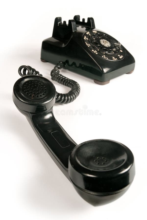 Image of an old beatup rotary telephone. Focus is on the mouthpiece. Image of an old beatup rotary telephone. Focus is on the mouthpiece.