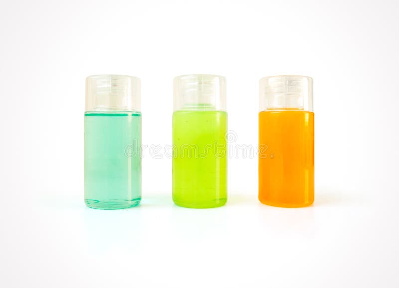 Drei kleine Plastikflaschen voll bunte kosmetische Produkte stockfotos Drei kleine Plastikflaschen voll bunte kosmetische Produkte stockfotos